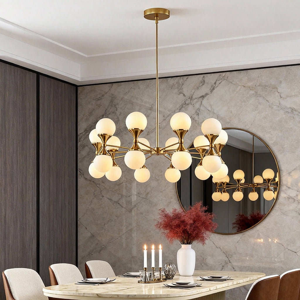 Bubble glass chandelier in a dining room with a marble wall
