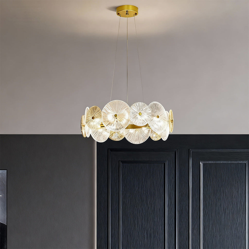 Large glass chandelier hanging above a modern dining table