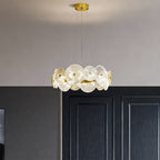 Large glass chandelier hanging above a modern dining table