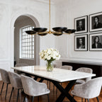 Five-light disc chandelier above a marble table in a formal room