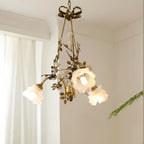 Flower chandelier as a focal point beside flowing curtains