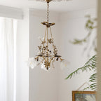 Flower chandelier hanging against serene white walls