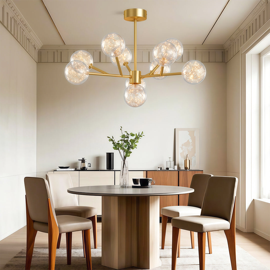 Globe chandelier above minimalist brown leather chairs