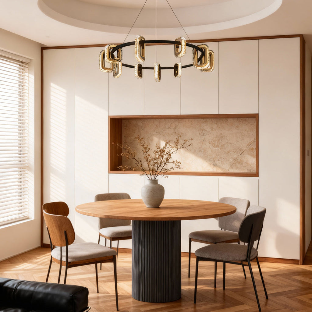 Gold tiered chandelier in a dining area with abstract artwork