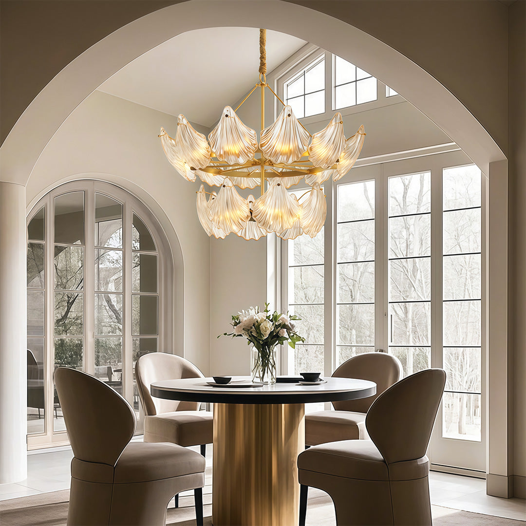 Large chandelier in a dining room with arched windows