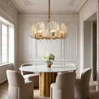 Large chandelier in a room with elegant white panelled walls