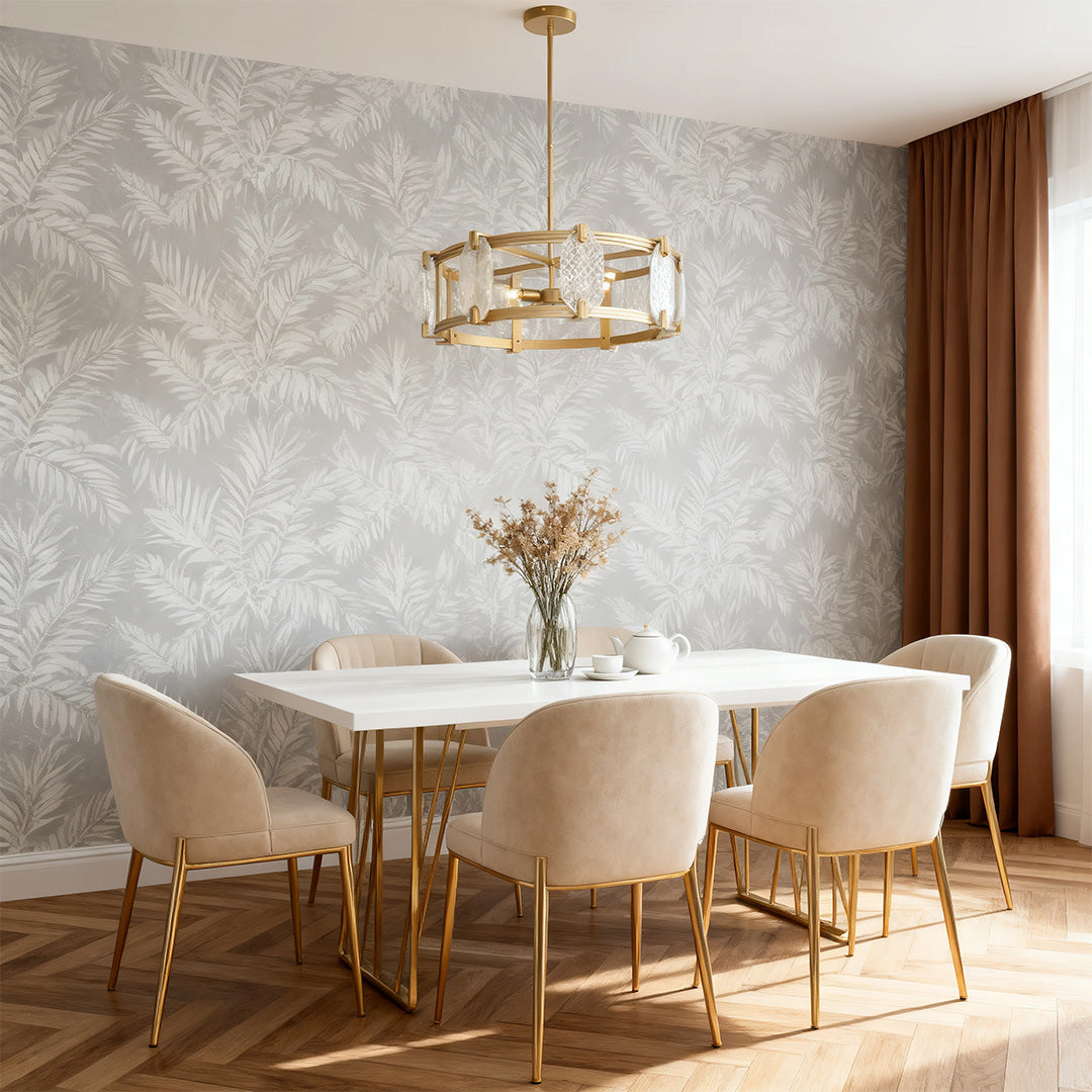 Round glass chandelier in a dining room with leaf wallpaper