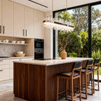 LED chandelier above a kitchen island with outdoor views