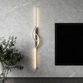 Black linear wall sconce mounted on a textured gray wall