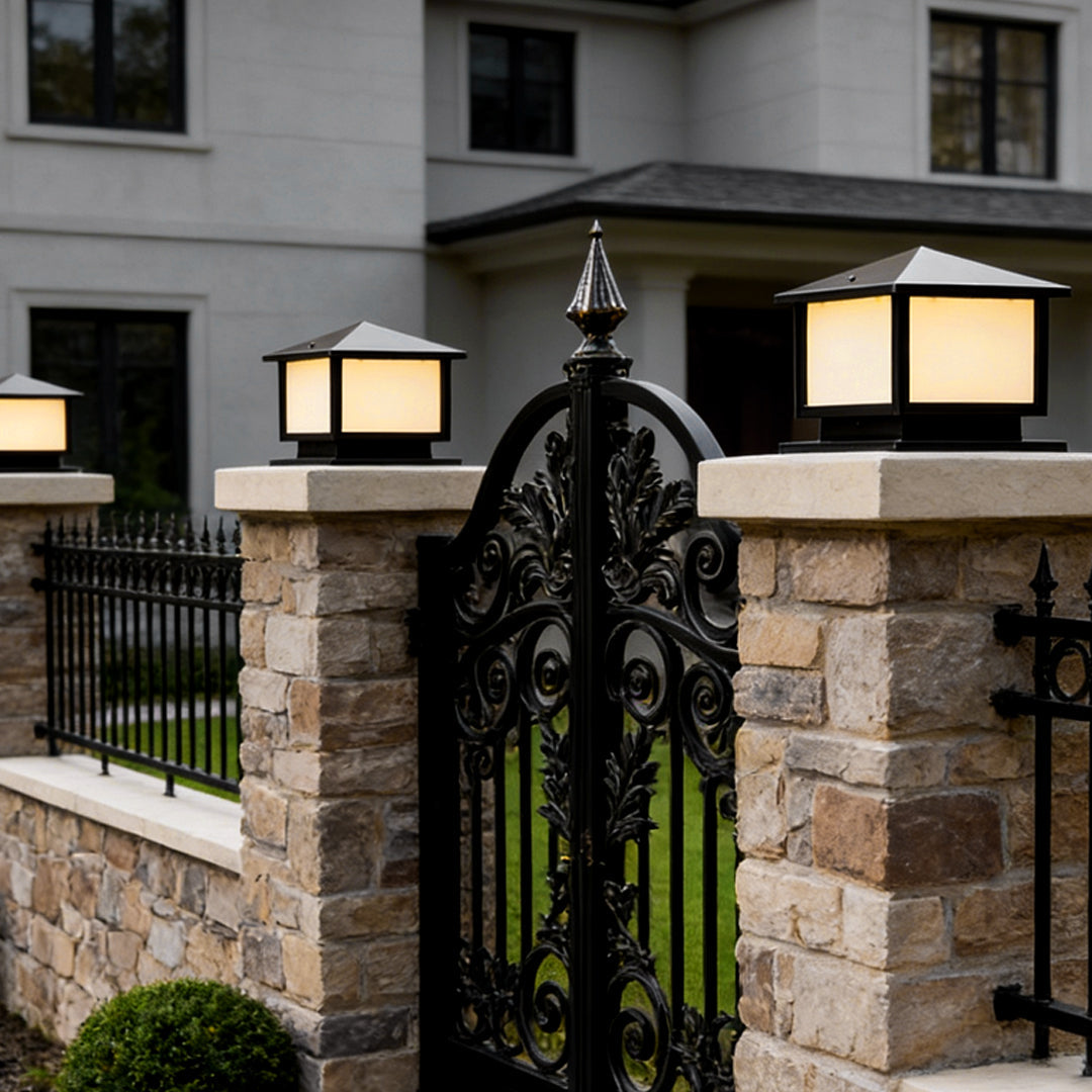 Pillar cap light on a gate pillar beside a driveway