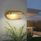 Oval bulkhead light on a modern exterior wall