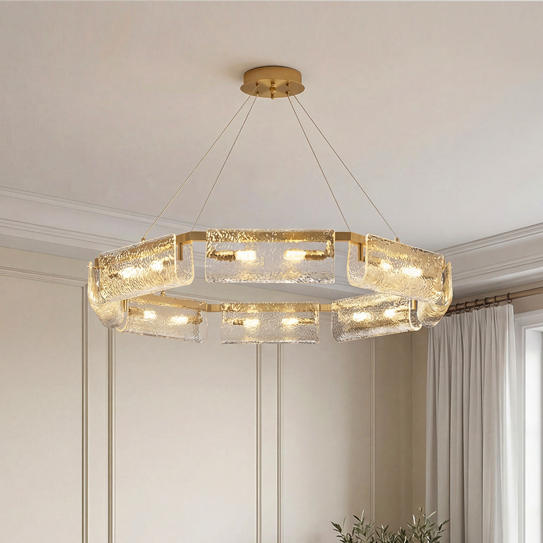 Rectangular brass chandelier with textured ice-effect glass panels shown lit