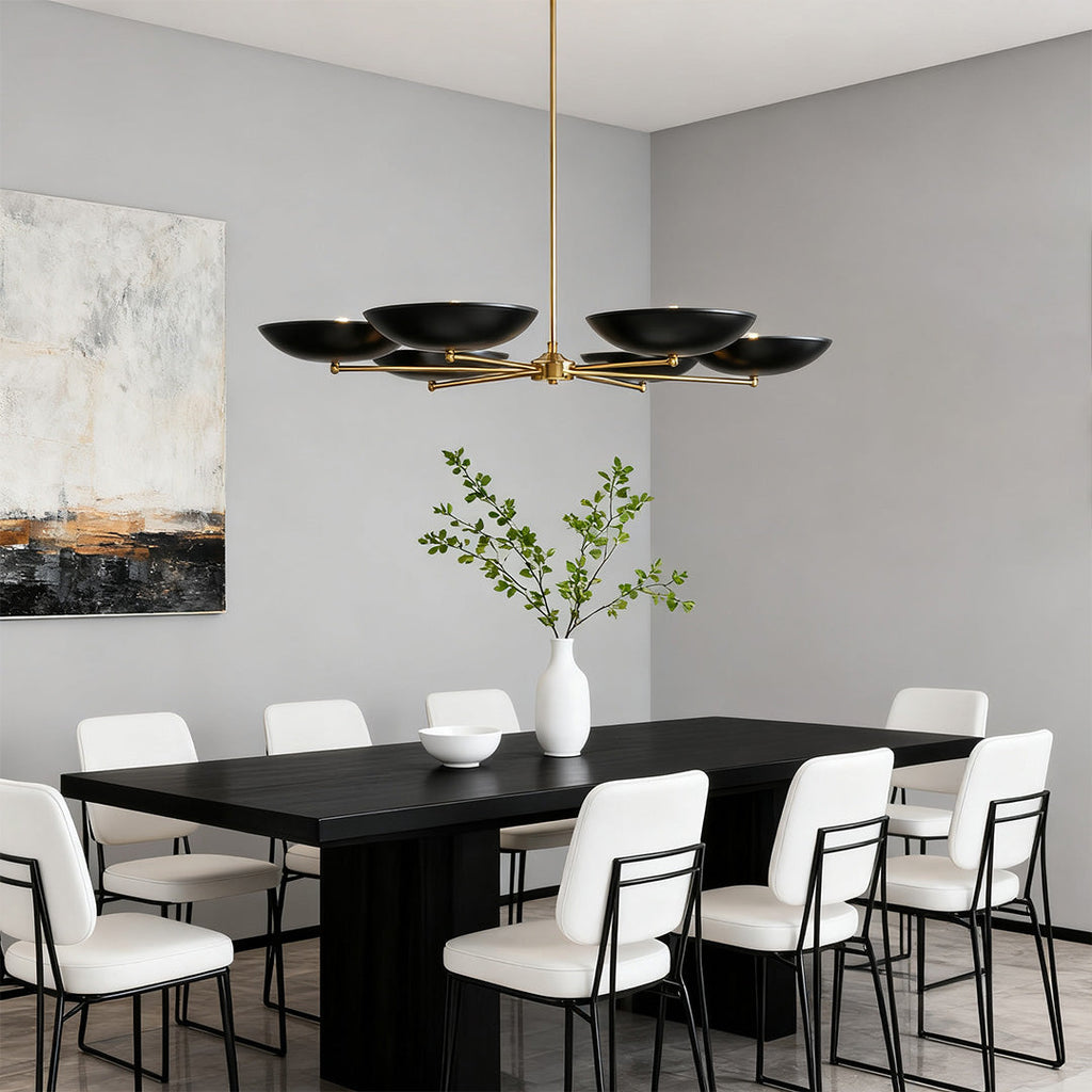 Six-light disc shade chandelier above a long black table