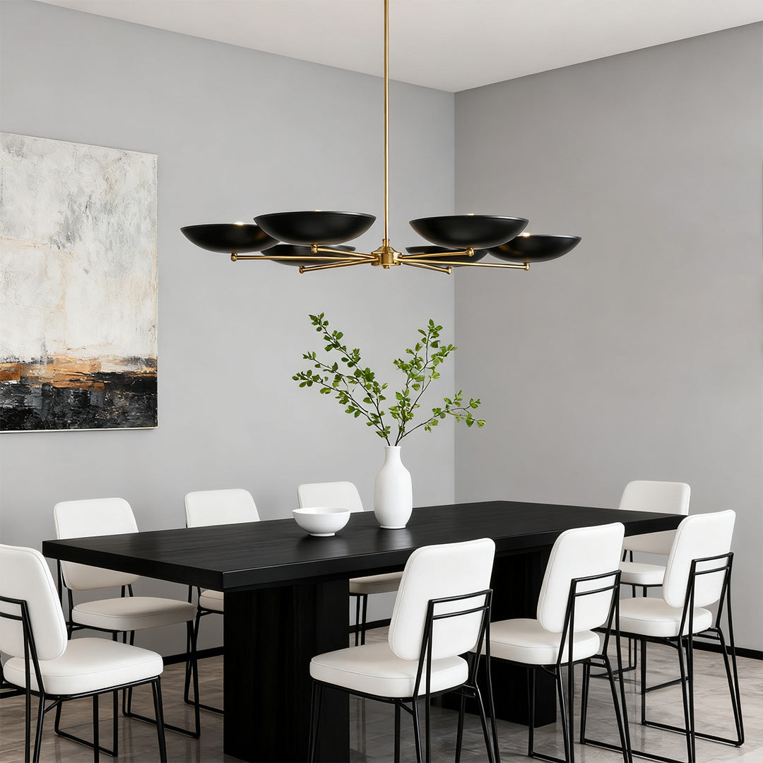 Six-light disc shade chandelier above a long black table