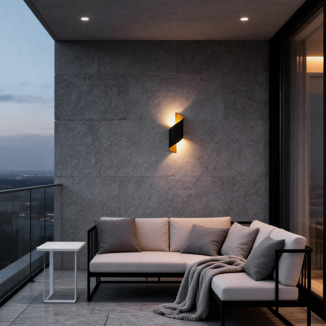 Spiral wall light giving a warm glow on a cozy balcony