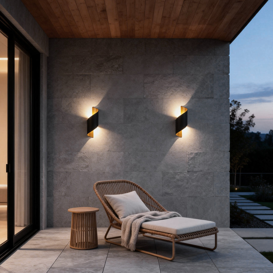 Spiral wall light softly lighting an outdoor patio