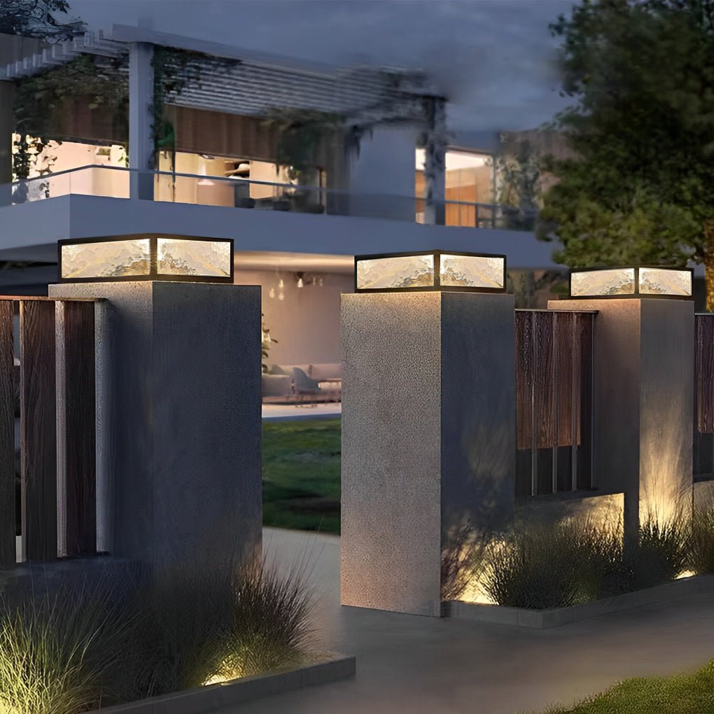 Square pillar lights topping a pair of modern concrete columns