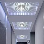 Sunburst ceiling light with geometric spokes in a stylish hallway