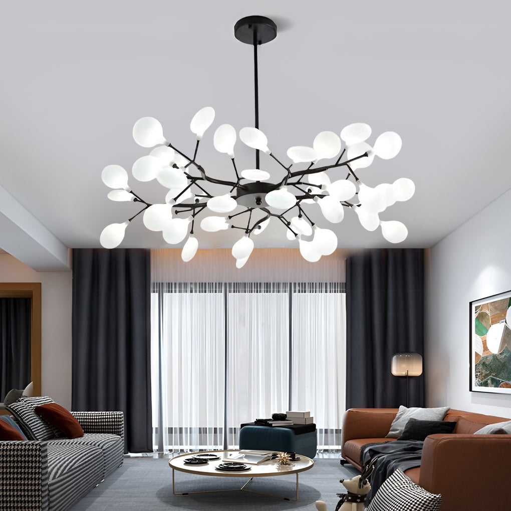 Branch chandelier giving ambient light over a cozy sofa area