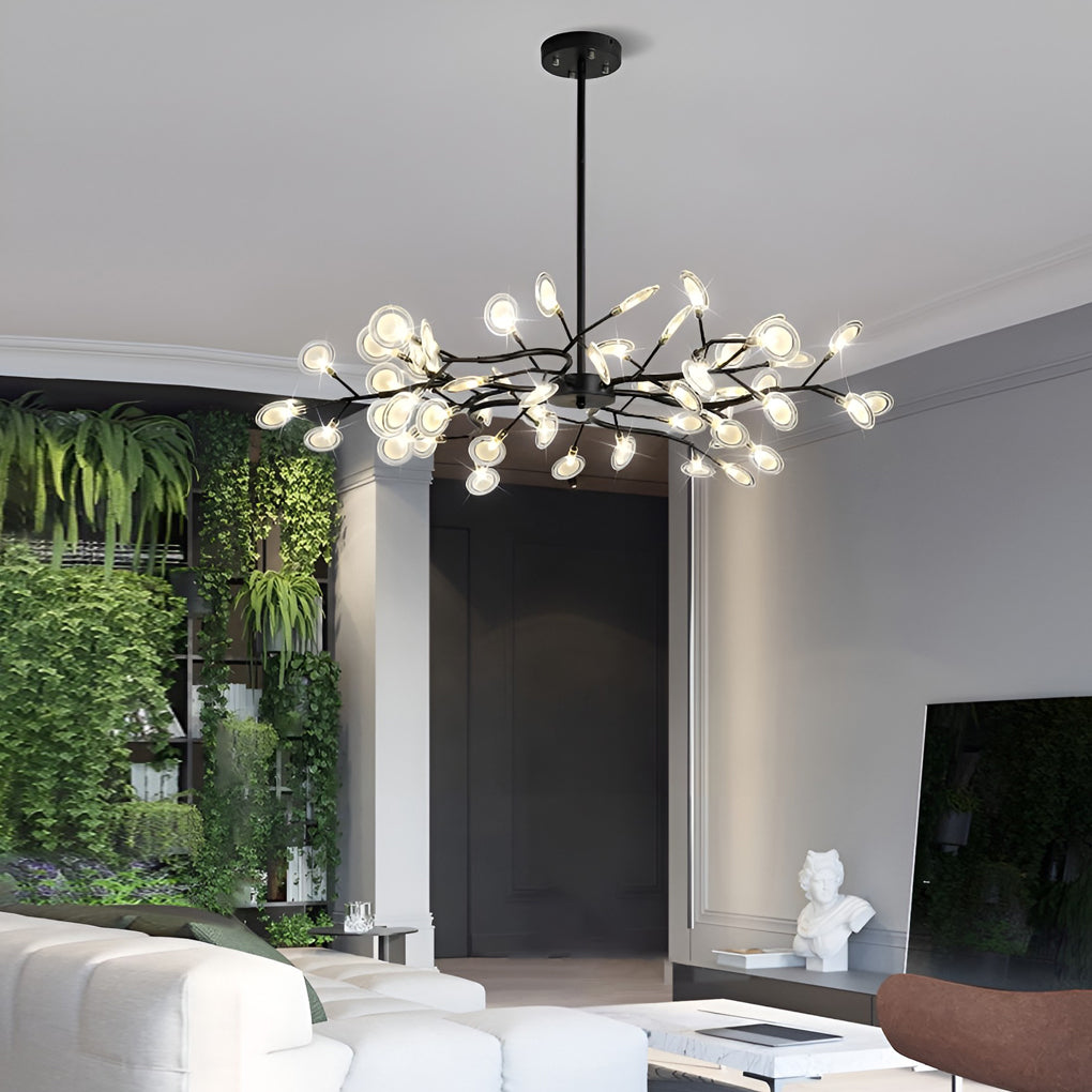 Branch chandelier in a living room with green wall accents