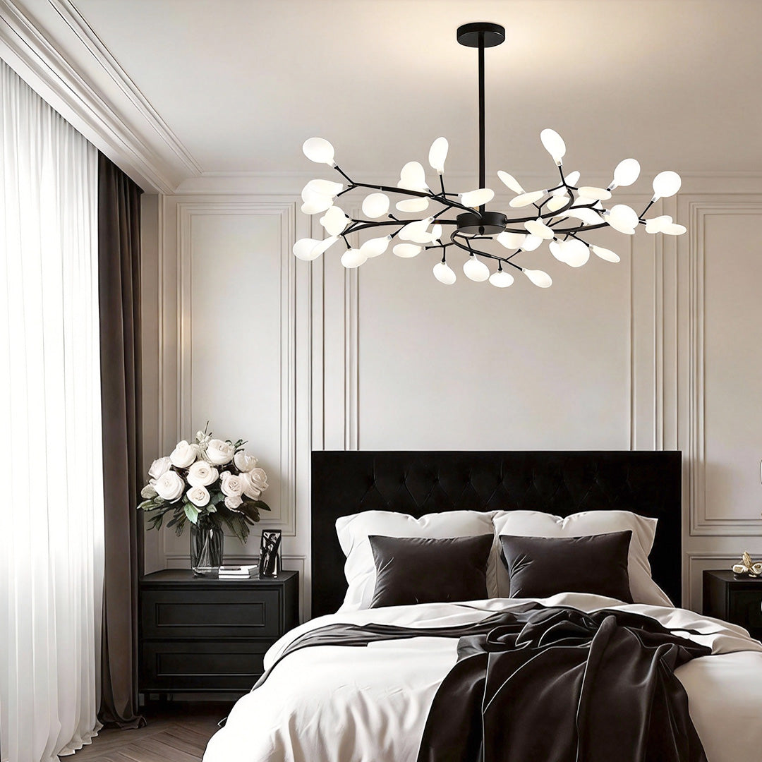 Branch chandelier giving a warm glow in a luxurious bedroom