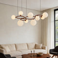 Opal glass globe chandelier above a cozy living room sofa