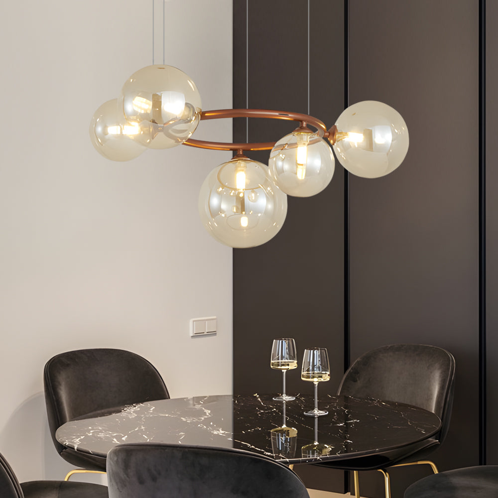 Globe chandelier above a stylish modern dining table