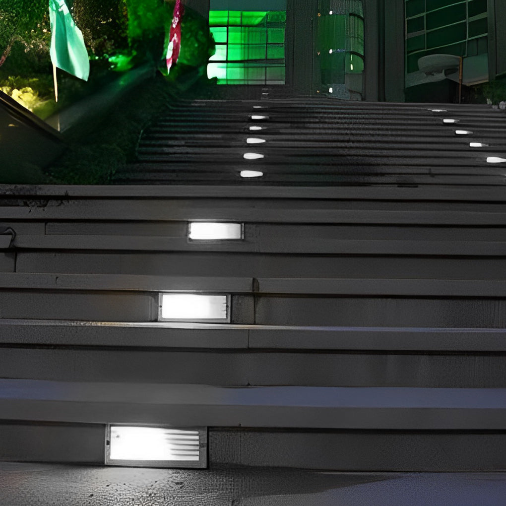 Row of recessed brick lights along wide exterior stairs