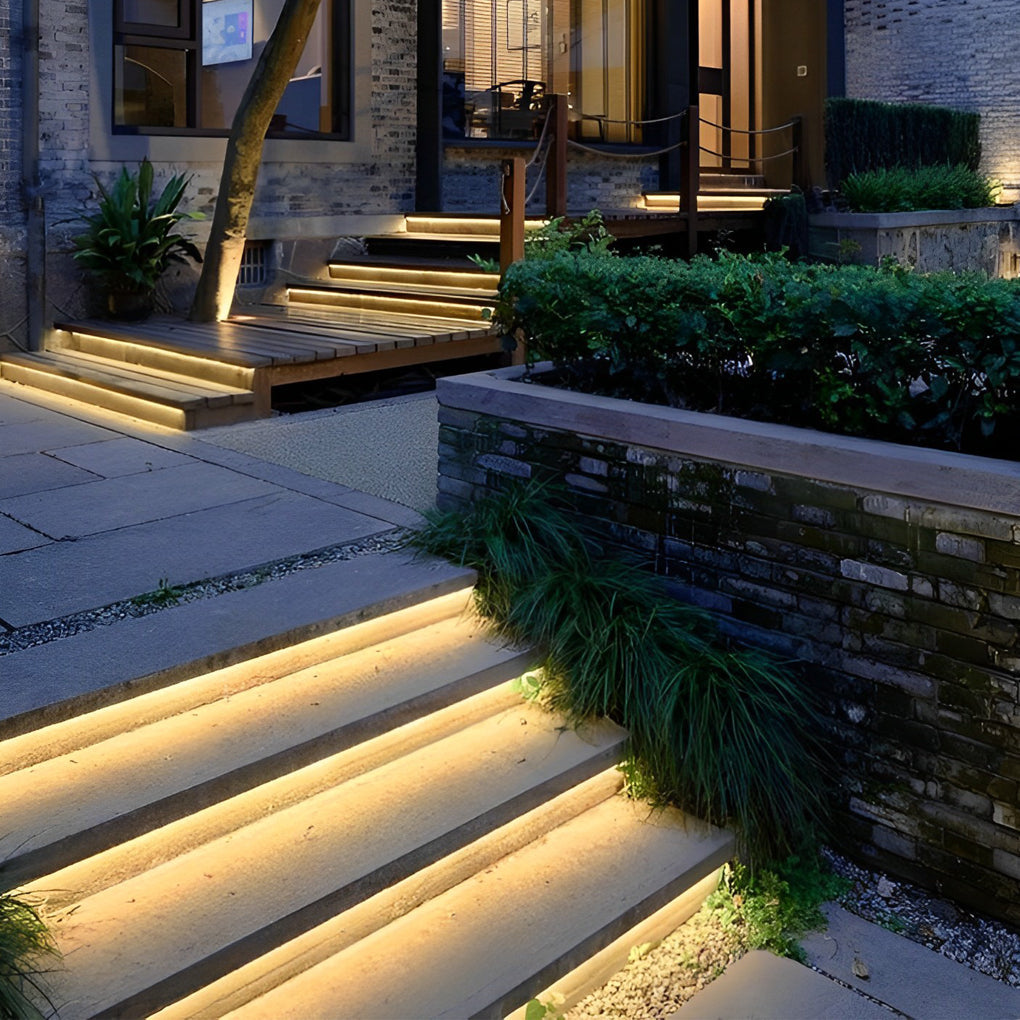 Warm ambient glow along the edges of a modern staircase