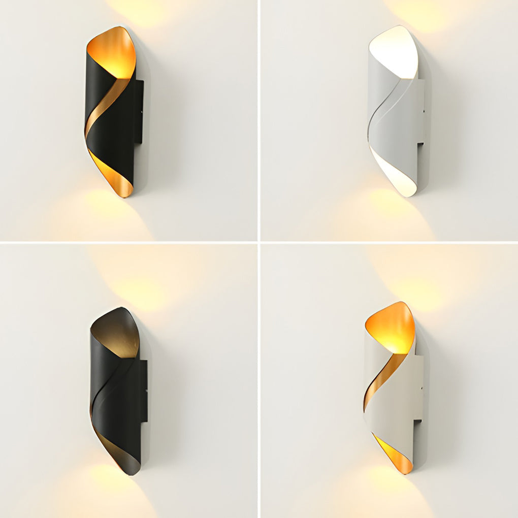 Black cylinder sconce on a white hallway wall