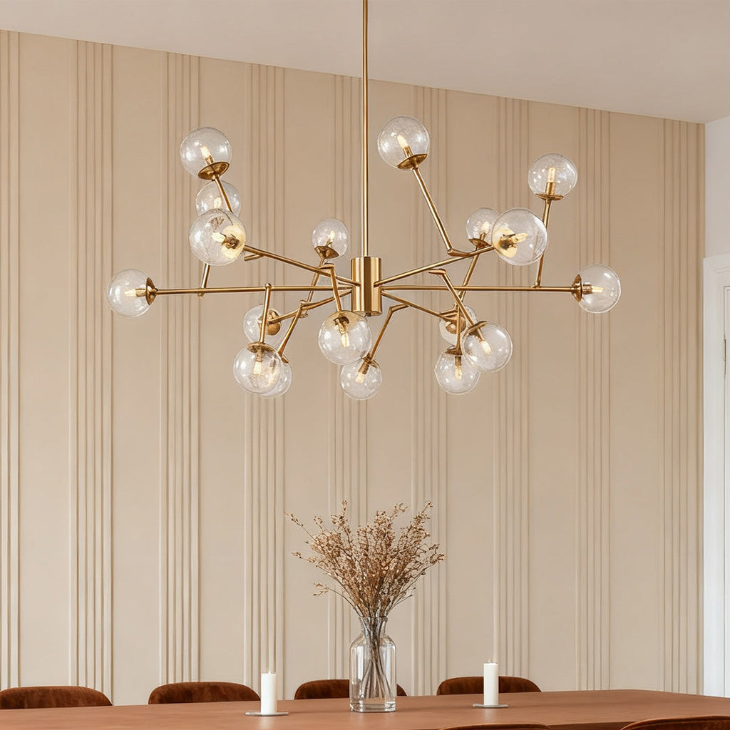 Oversized clear shade chandelier used as a dining centerpiece