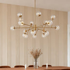 Oversized clear shade chandelier used as a dining centerpiece