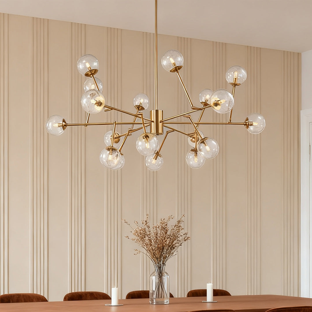 Oversized clear shade chandelier used as a dining centerpiece