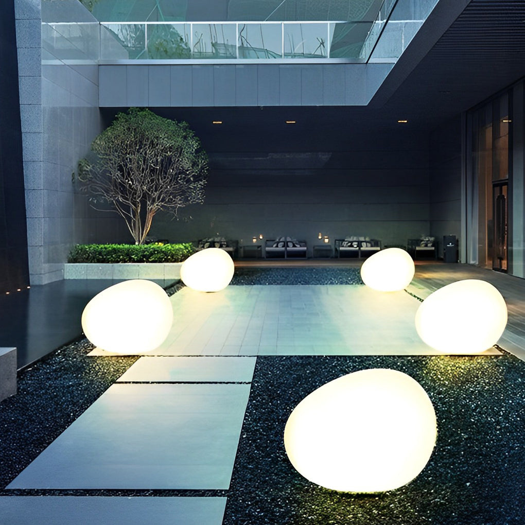 Pebble lights creating a cozy atmosphere in a pool seating area