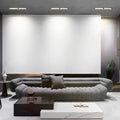 Recessed linear spotlights in a modern living room ceiling