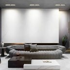 Recessed linear spotlights in a modern living room ceiling