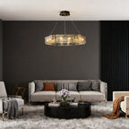 Rectangular glass chandelier above an elegant grey sofa