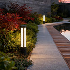 Bollard lights seen in a wider pathway landscape view