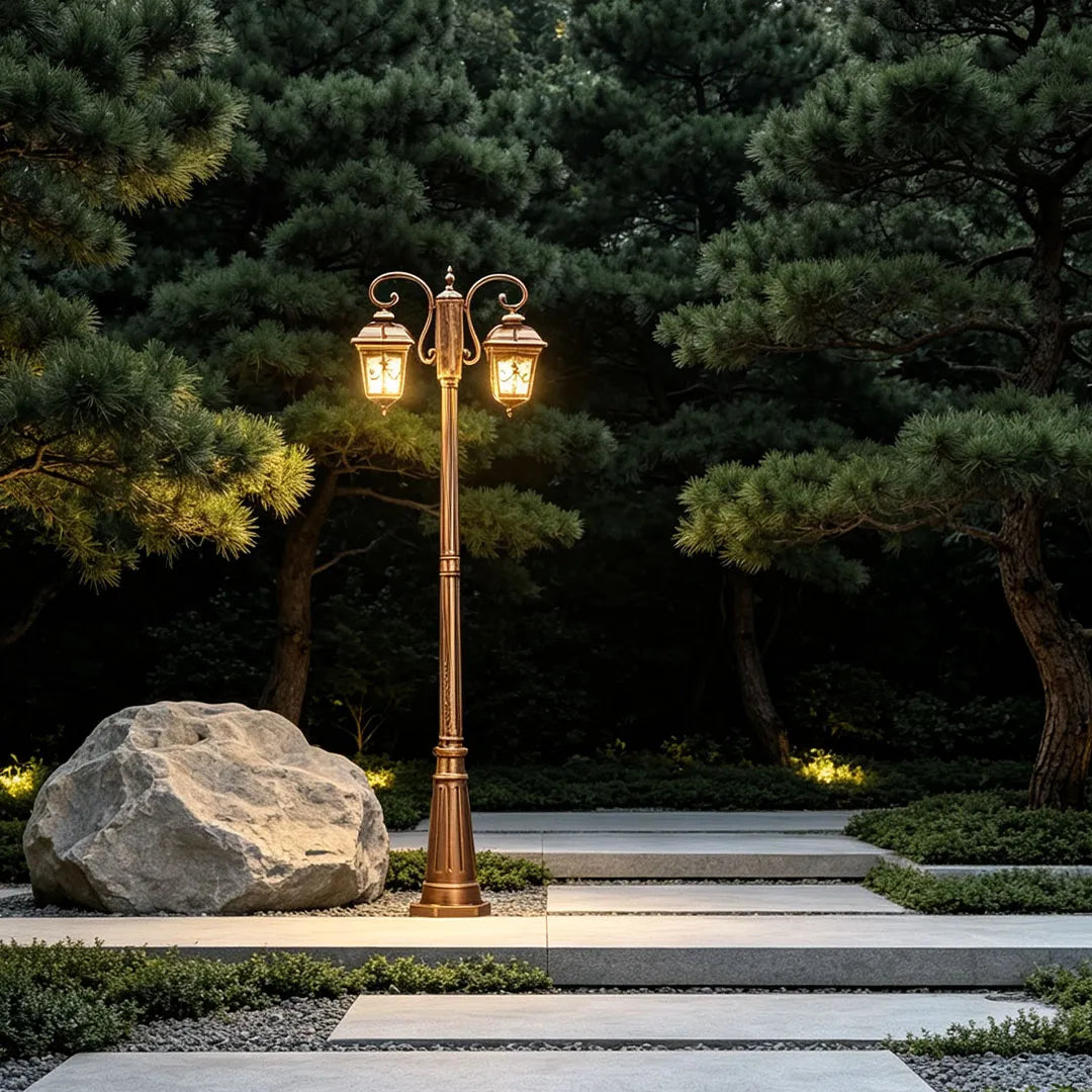 Retro lamp post beside stone steps in landscaped planting