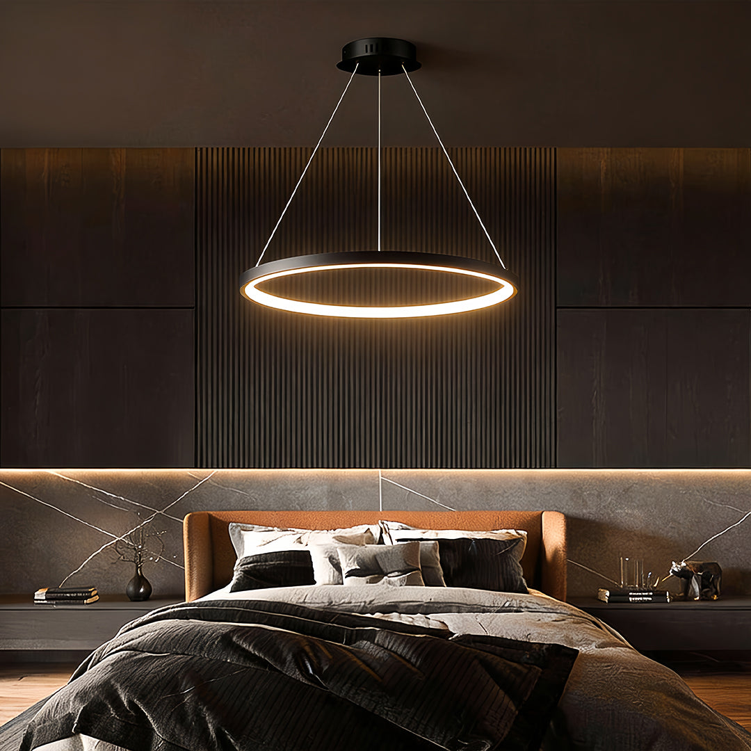 Black single ring chandelier lighting a modern bedroom