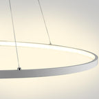 Detail of the white illuminated ring of the chandelier