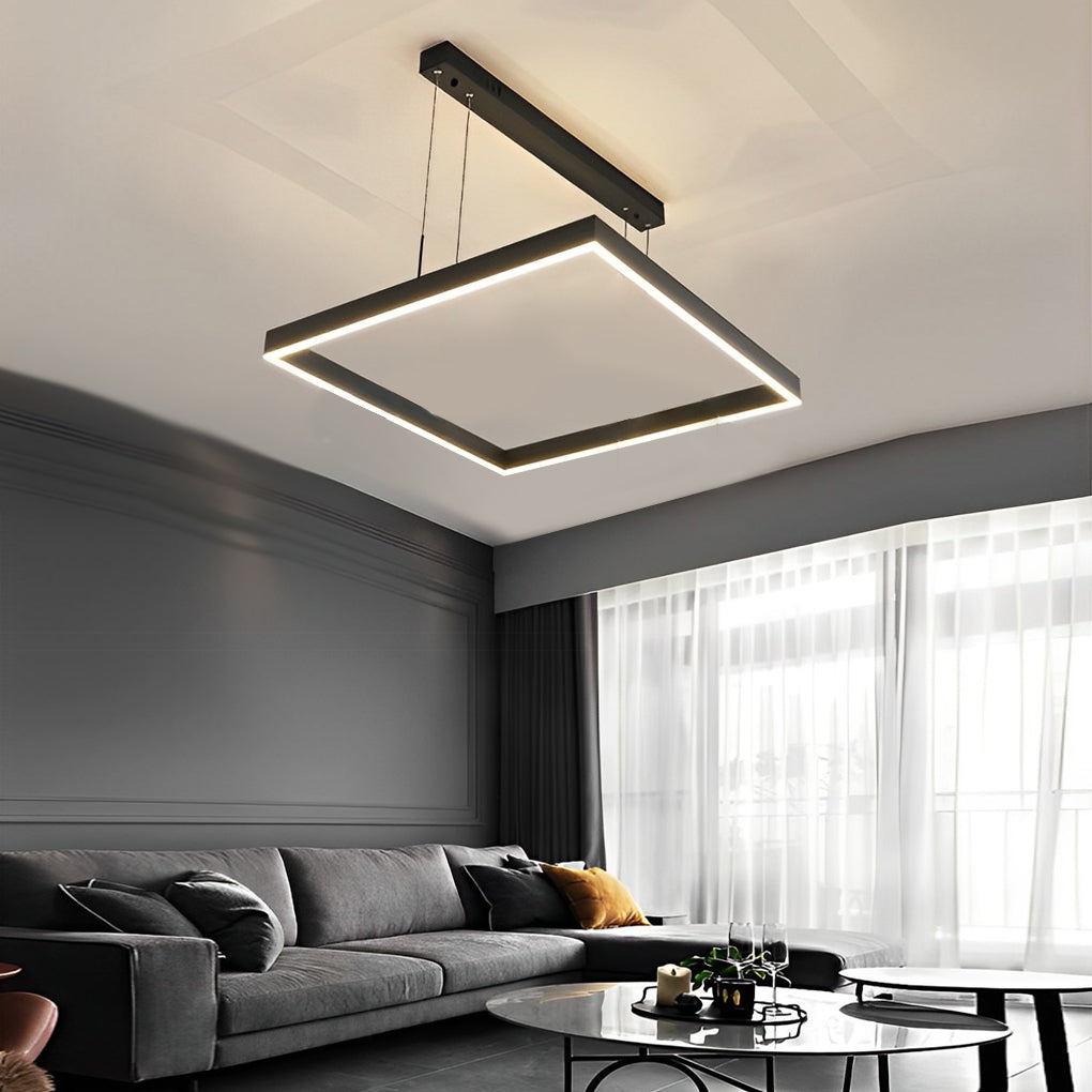 Square chandelier giving warm light above a modern sofa area
