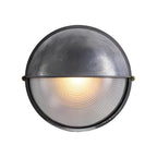 Round bulkhead light showing its textured glass diffuser cover