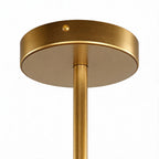 Gold finish ceiling mount of the chandelier shown close up