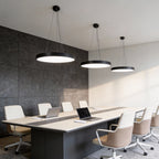 Round pendant lights in a designed conference room