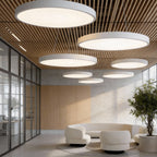 Round pendant lights suspended in a modern lobby