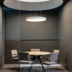 Round pendant light in a private meeting space