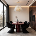 Deco chandelier above a round table in a modern interior