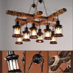 Front view of the eight-light wood and glass chandelier