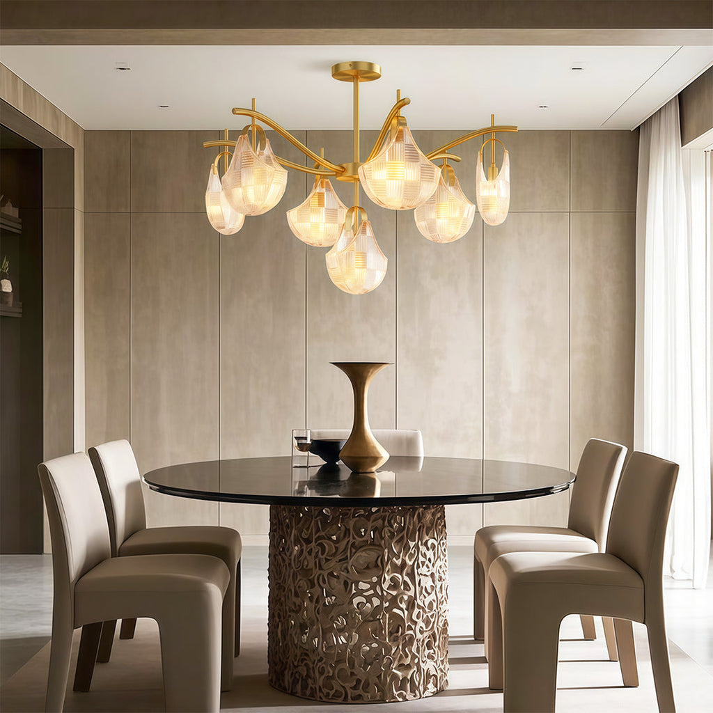 Shell chandelier above a contemporary fluted dining table